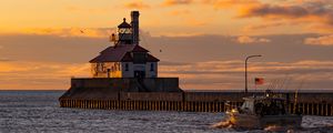 Preview wallpaper lighthouse, building, sea, sunset, waves