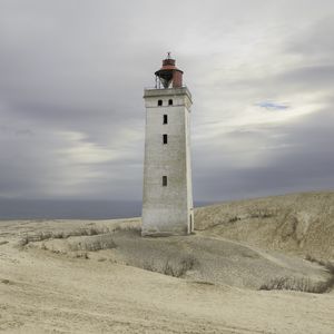 Preview wallpaper lighthouse, building, shore, sea, sky