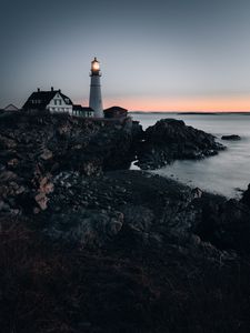 Preview wallpaper lighthouse, building, shore, sea, dusk