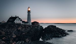 Preview wallpaper lighthouse, building, shore, sea, dusk