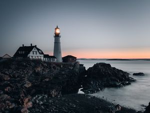 Preview wallpaper lighthouse, building, shore, sea, dusk