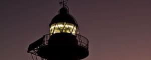 Preview wallpaper lighthouse, building, silhouette, sunset, coast