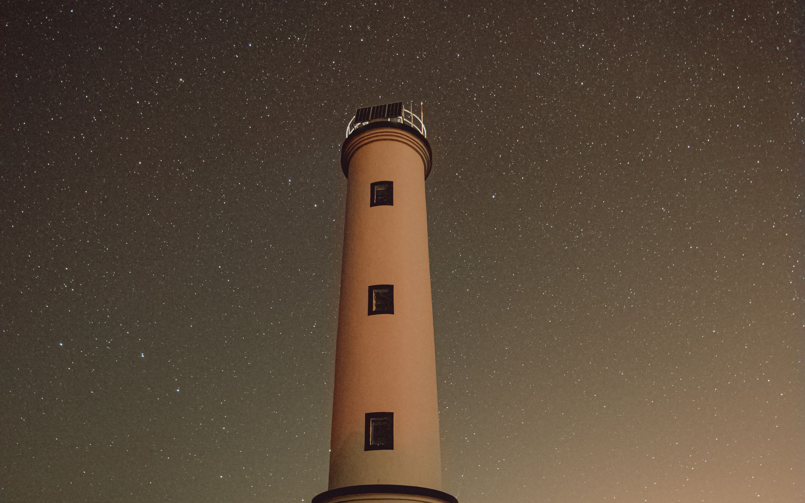 Download wallpaper 2560x1600 lighthouse, building, starry sky, stars