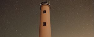 Preview wallpaper lighthouse, building, starry sky, stars, night, rocks
