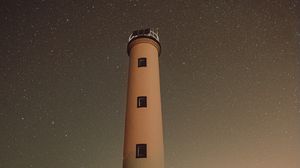 Preview wallpaper lighthouse, building, starry sky, stars, night, rocks