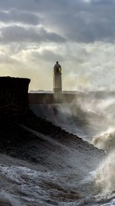 Preview wallpaper lighthouse, building, waves, spray, sky