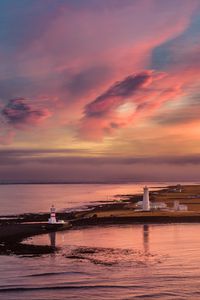 Preview wallpaper lighthouse, buildings, island, sea, evening