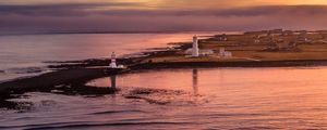 Preview wallpaper lighthouse, buildings, island, sea, evening