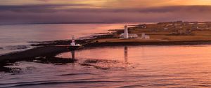 Preview wallpaper lighthouse, buildings, island, sea, evening