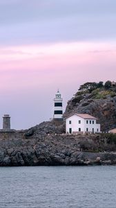 Preview wallpaper lighthouse, buildings, rock, sea