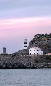 Preview wallpaper lighthouse, buildings, rock, sea
