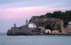 Preview wallpaper lighthouse, buildings, rock, sea