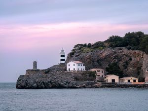 Preview wallpaper lighthouse, buildings, rock, sea