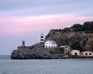 Preview wallpaper lighthouse, buildings, rock, sea