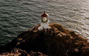 Preview wallpaper lighthouse, cliff, sea, aerial view, building