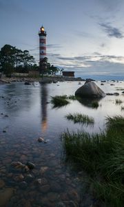 Preview wallpaper lighthouse, coast, building, sea, evening