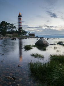 Preview wallpaper lighthouse, coast, building, sea, evening