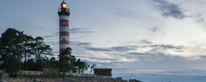 Preview wallpaper lighthouse, coast, building, sea, evening