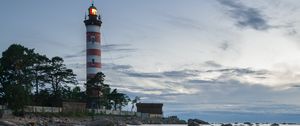 Preview wallpaper lighthouse, coast, building, sea, evening