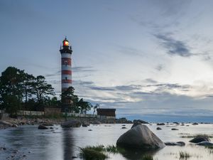 Preview wallpaper lighthouse, coast, building, sea, evening