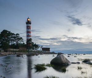 Preview wallpaper lighthouse, coast, building, sea, evening