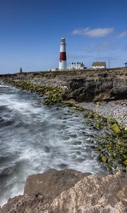 Preview wallpaper lighthouse, coast, foam, rocks