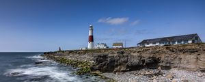 Preview wallpaper lighthouse, coast, foam, rocks