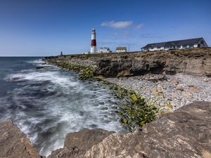 Preview wallpaper lighthouse, coast, foam, rocks