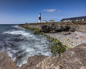 Preview wallpaper lighthouse, coast, foam, rocks