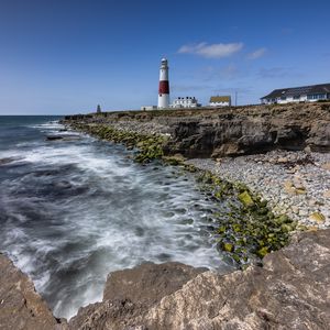 Preview wallpaper lighthouse, coast, foam, rocks