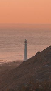 Preview wallpaper lighthouse, coast, fog, dusk