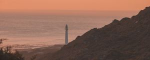 Preview wallpaper lighthouse, coast, fog, dusk