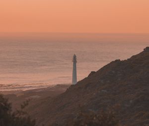 Preview wallpaper lighthouse, coast, fog, dusk