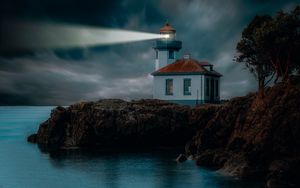 Preview wallpaper lighthouse, coast, glow, rocks, night