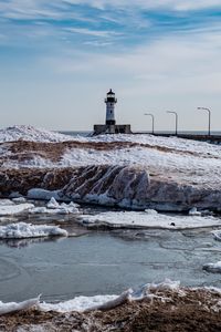 Preview wallpaper lighthouse, coast, river, ice, snow