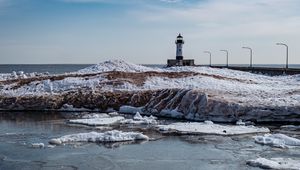 Preview wallpaper lighthouse, coast, river, ice, snow