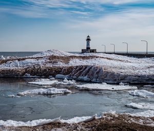 Preview wallpaper lighthouse, coast, river, ice, snow