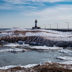 Preview wallpaper lighthouse, coast, river, ice, snow