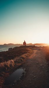 Preview wallpaper lighthouse, coast, rocks, road, nature