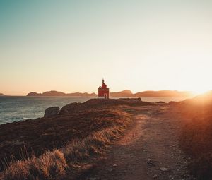 Preview wallpaper lighthouse, coast, rocks, road, nature