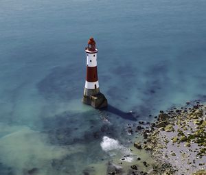 Preview wallpaper lighthouse, coast, sea, minimalism