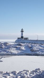 Preview wallpaper lighthouse, coast, snow, water, winter, nature