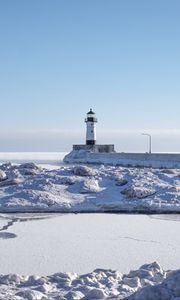Preview wallpaper lighthouse, coast, snow, water, winter, nature