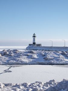 Preview wallpaper lighthouse, coast, snow, water, winter, nature