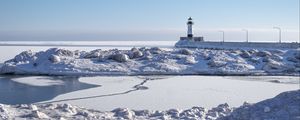 Preview wallpaper lighthouse, coast, snow, water, winter, nature