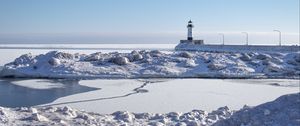 Preview wallpaper lighthouse, coast, snow, water, winter, nature