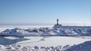 Preview wallpaper lighthouse, coast, snow, water, winter, nature