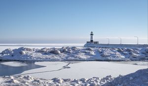 Preview wallpaper lighthouse, coast, snow, water, winter, nature