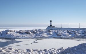 Preview wallpaper lighthouse, coast, snow, water, winter, nature