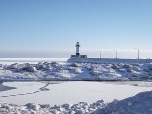 Preview wallpaper lighthouse, coast, snow, water, winter, nature